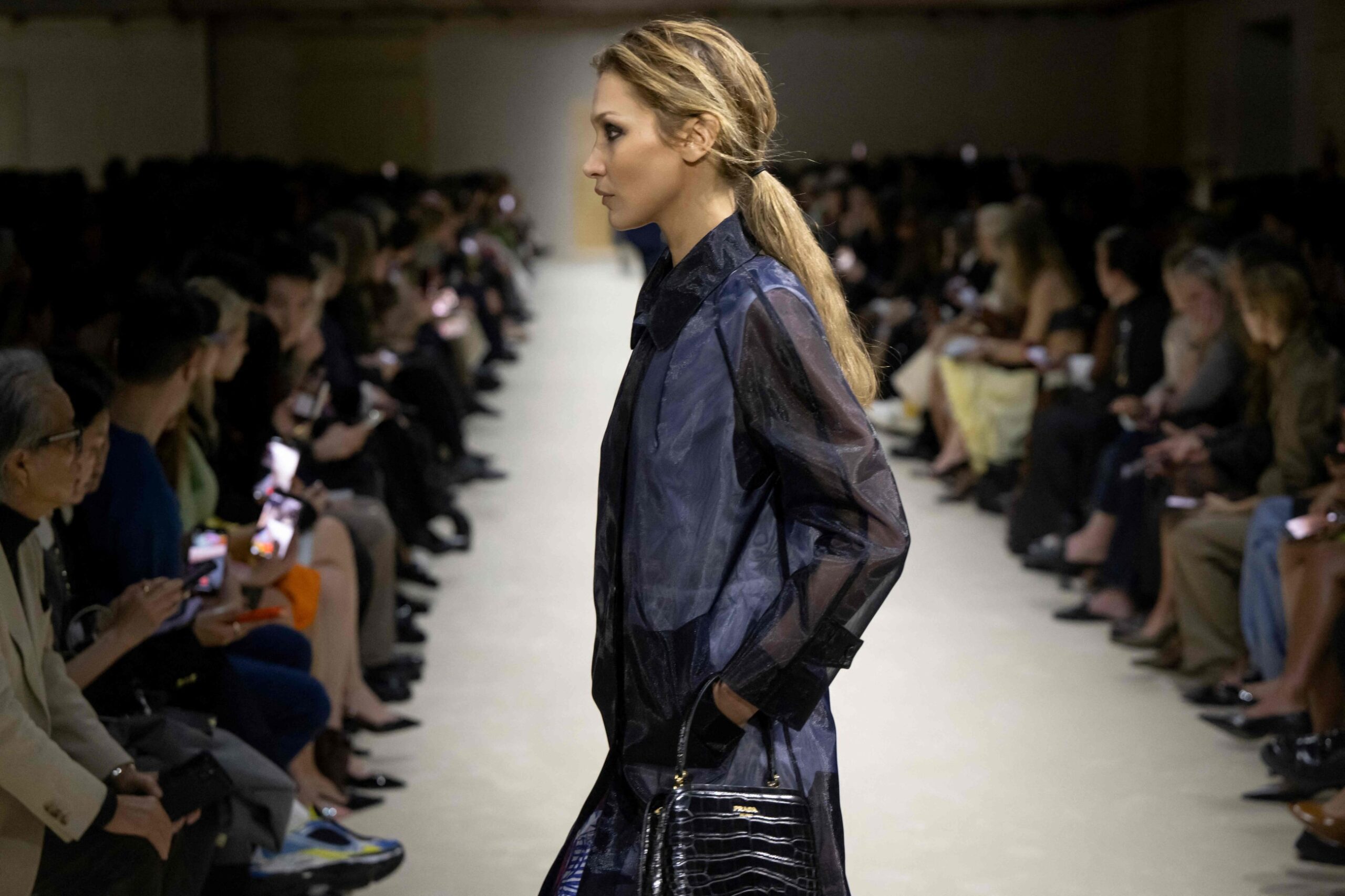 Prada layers winter jackets over light dresses at Milan Fashion Week