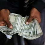 Indian rupee sinks to record low