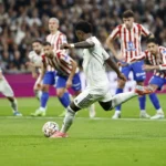 Vinicius double helps Real edge past Atletico thriller