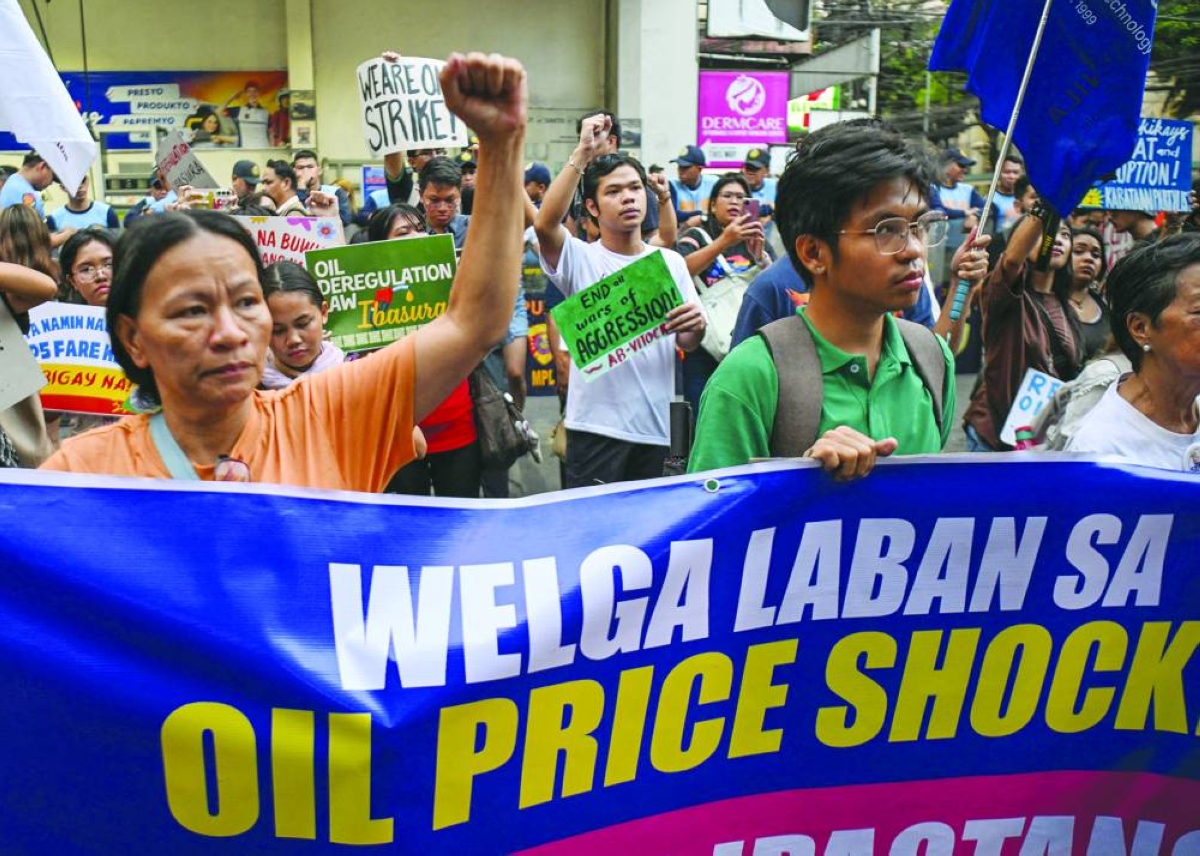 Philippine jeepney drivers protest as rising fuel prices cut their pay