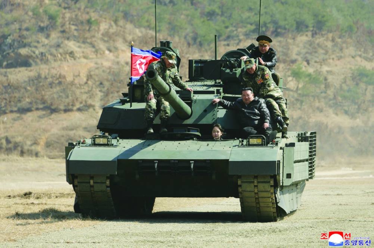 North Korean leader, daughter try out new tank