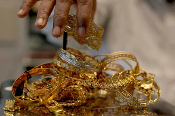 Gold declines as stronger dollar weighs on prices