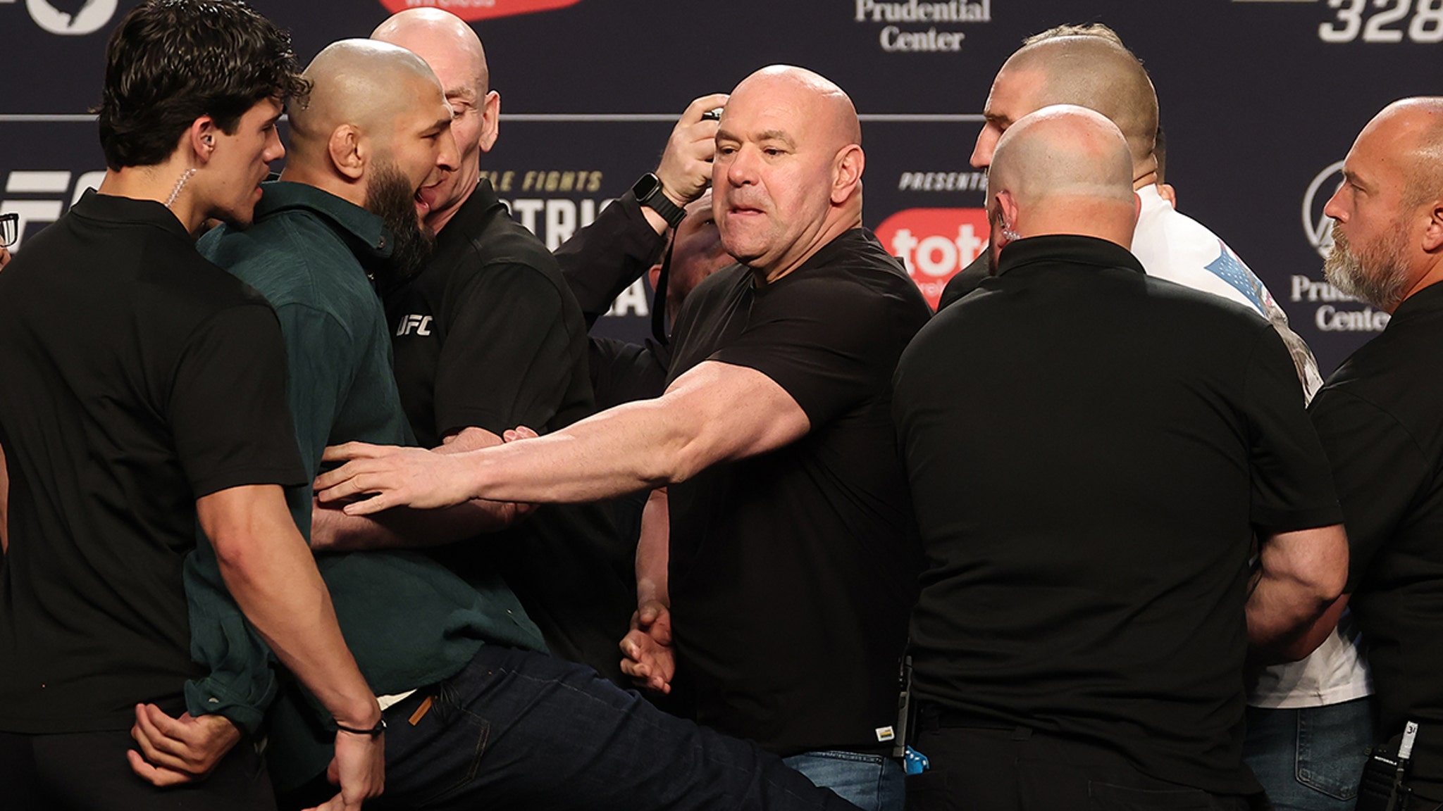Khamzat Chimaev Kicks Sean Strickland At UFC Presser, Armed Security On Stage