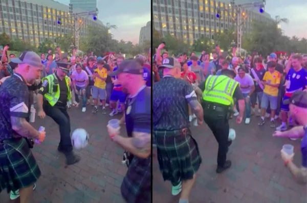 Boston police officer joins fans with football jug…