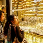 Gold holds near two-week high