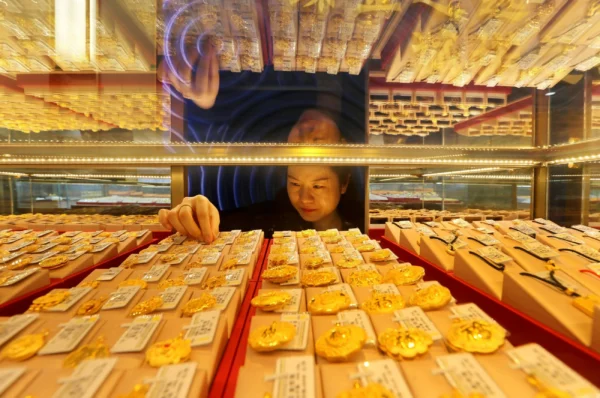 Gold on track to end four-month slump as investors weigh Fed signals