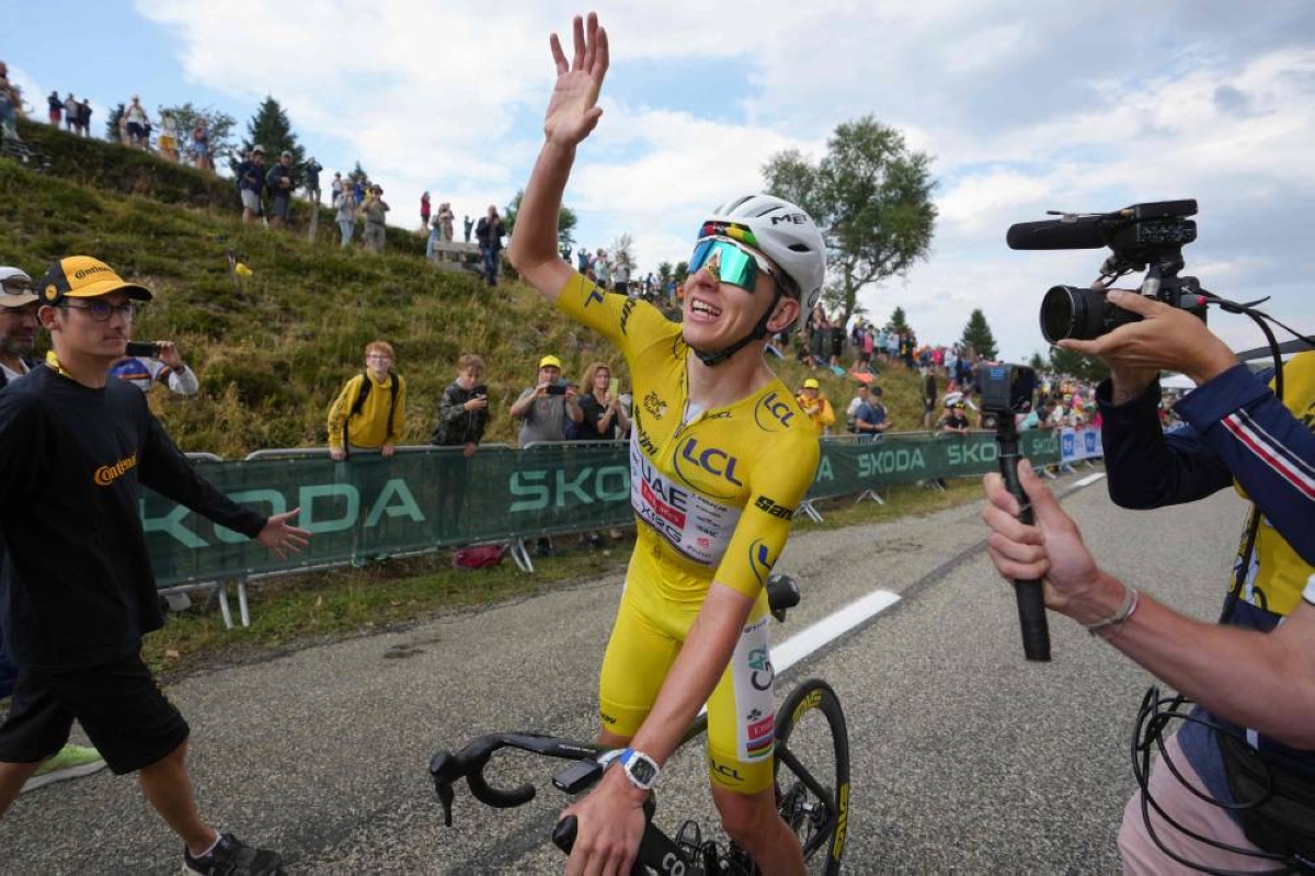 Pogacar wins ‘unforgettable’ Tour de France 14th stage to extend overall lead