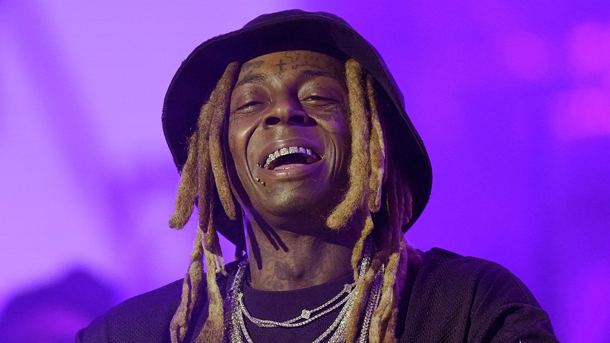 Lil Wayne Required Ex-Assistant to Have ‘Pleasant Hygiene,’ Roll Blunts, Love Dogs